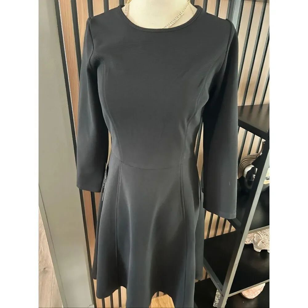 The limited black long sleeve dress low high size extra small NWT